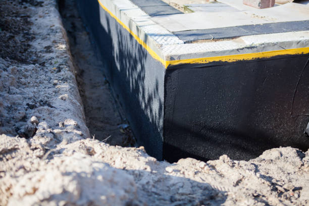Professional Basement Waterproofing technician working in Long Lake, IL
